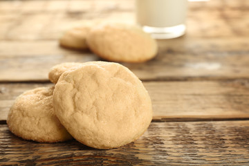 Tasty sugar cookies on wooden table