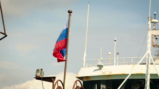 Tricolor Flag Waving on Russian Boat. Deck of White Ship. Day Time