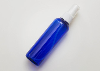 Blue bottle with a white spray cap