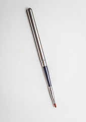 Brushes for make-up and precious stones.