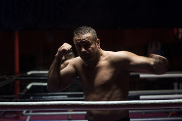 Fototapeta na wymiar professional kickboxer in the training ring