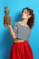 lwoman with pineapple. Pin up style.