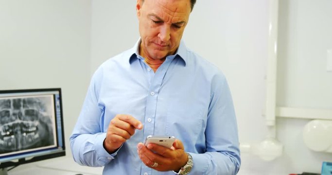 Dentist using mobile phone