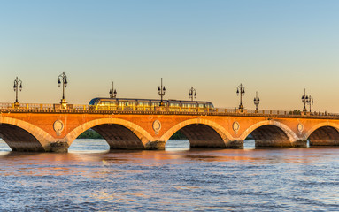City tram on Pont de Pierre bridge in Bordeaux, France