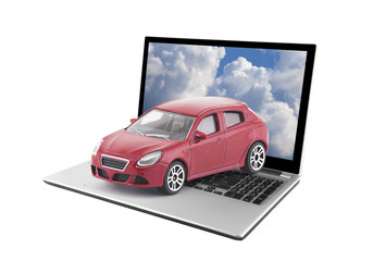 Toy car on laptop isolated on white background
