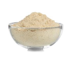Glass bowl with flour on white background