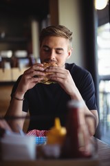 Man eating burger