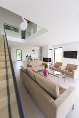 family with little girl enjoys in the modern living room