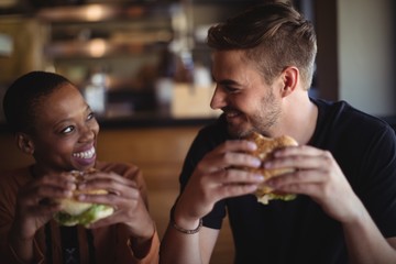 Happy couple having burger