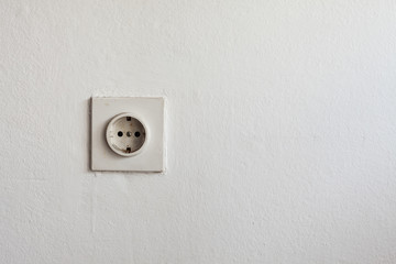 Old Plug in White Wall