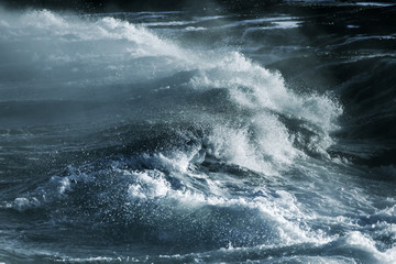 Fototapeta na wymiar Big stormy ocean wave. Blue water background