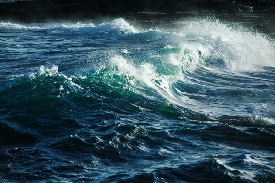 Fototapeta Big stormy ocean wave. Blue water background
