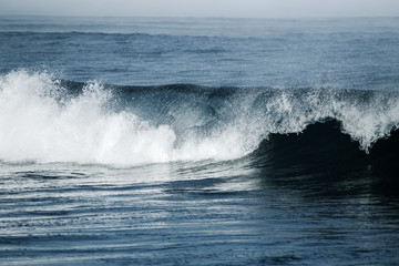 Big stormy ocean wave. Blue water background