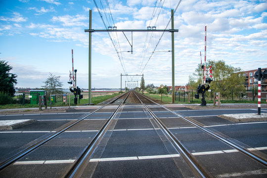 train road with some clouds and blue sky