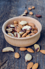 Nuts mix in wooden bowl