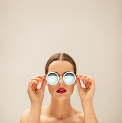 Portrait of young woman with sunglasses