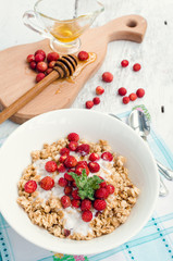 Granola with yoghurt and wild strawberries
