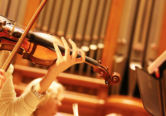 Woman playing the violin. Rehearsal Symphony orchestra.