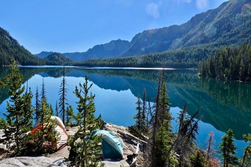 Camping tents near lake  in Cascade Mountains.  Snow Lake in The Enchantment Lakes basin near Leavenworth and Seattle. WA. USA.
