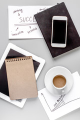 business plan development with notebook and coffee desk background top view mockup