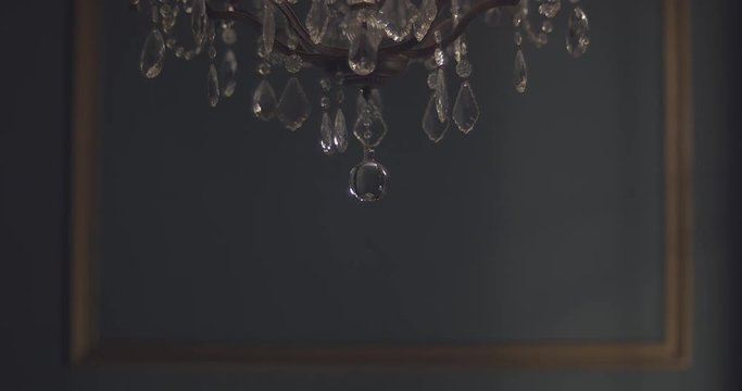 Chandelier falls toward the ground