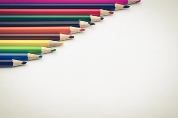 row of pencils on a white background with the place for the text/row of pencils on paper with a blank space for the text