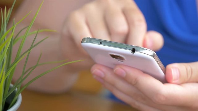 High quality video of woman using phone in 4K
