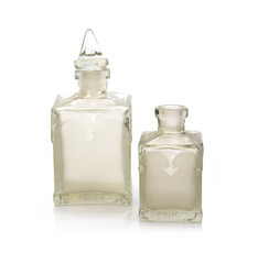 Old perfume bottle on white background. Isolated