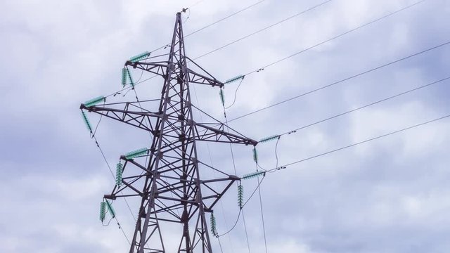 High-voltage tower of power lines. Risk of electric shock. Renewable electricity. Production and transportation of electricity by wire for longer distances. Electric power industry.