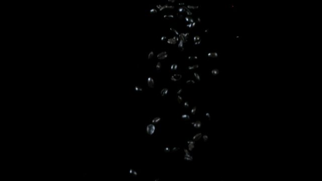 Abstract Jewels/Rocks/Droplets Falling Over Black Background