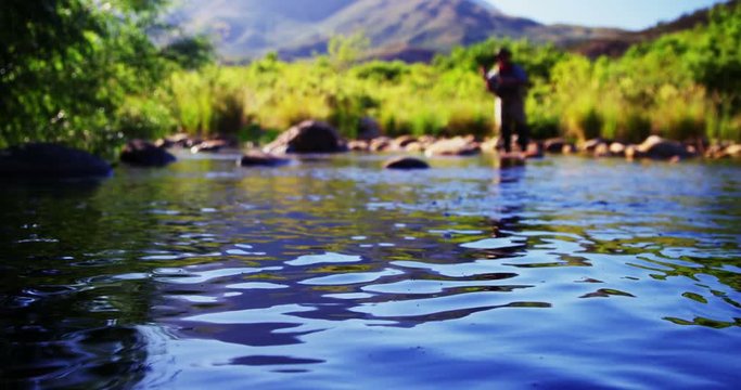 Man fly fishing in river