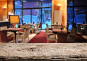 Perspective rustic wood over abstract blurred lights, ready for product montage