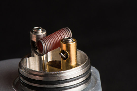 Coil is inserted into the drip tip and hot to dark red Clapton Coil on Dripper for vaping.