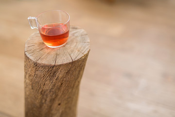 cup of tea on piece of wood