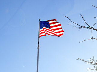American flag flying and billowing in the wind