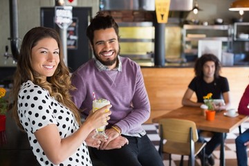 Portrait of happy friends in restaurant