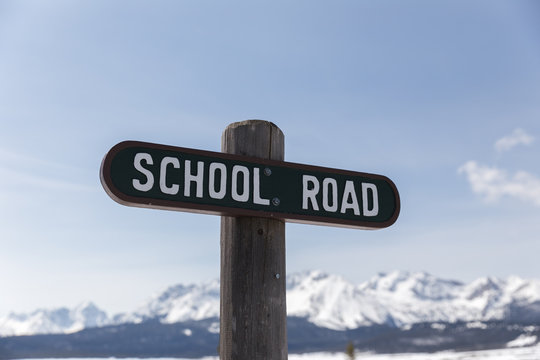 School Road Sign in Mountain Town