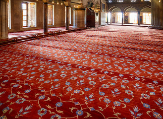 The prayer area covered with red carpets in Sultan Ahmed Mosque  (Blue Mosque), Istanbul.