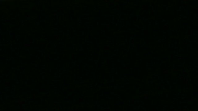 Row of empty seats in the theater with flashing concert lights.