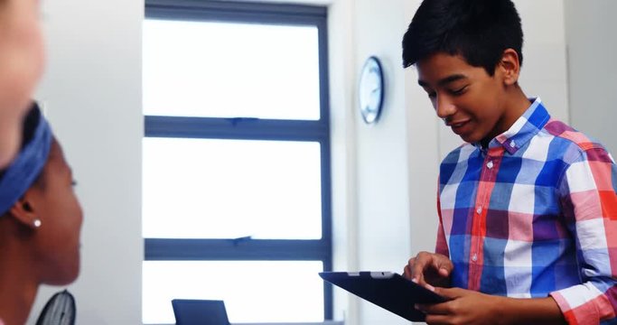 Mixed-race Boy Student Giving Presentation In Classroom