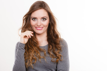 Portrait of happy attractive woman wearing grey top