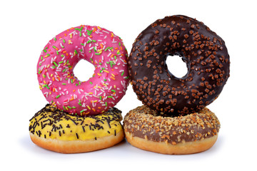 Donuts with colorful sugar icing isolated on white background. Sweet delicious pastries for breakfast.