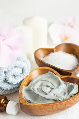 Spa setting. Cosmetic body And face mask made of blue clay