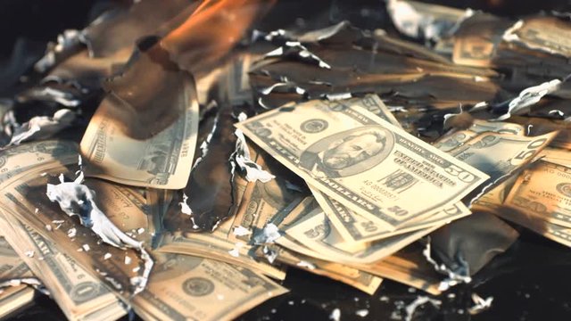 Slow motion of burning dollars