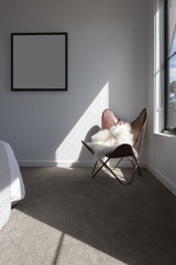 Sunshine highlight on a leather chair in a master bedroom