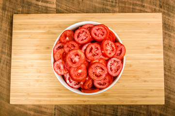 Bowl of red sliced tomatoes