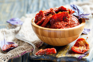 Sun-dried tomatoes and purple Basil in a round bowl.