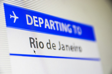 Computer screen close-up of status of flight departing to Rio de Janeiro, Brasil