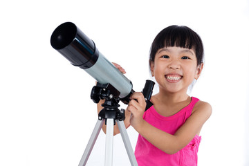 Asian Chinese little girl holding a telescope