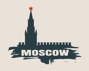 Obraz premium Spasskaya Tower of Kremlin and part of the wall in Moscow. City name on grunge brush.